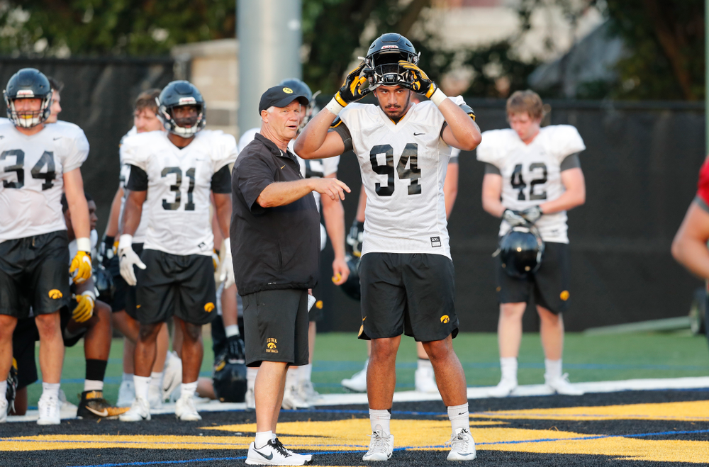 Defensive Line Coach Reese Morgan and defensive end A.J. Epenesa (94) during fall camp practice No. 4 Wednesday, August 2, 2017 at the Kenyon Football Practice Facility. (Brian Ray/hawkeyesports.com)