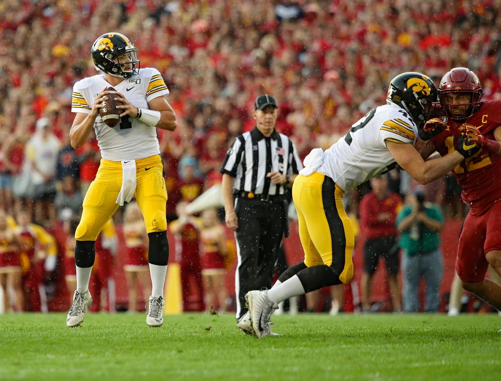 Iowa Hawkeyes quarterback Nate Stanley (4) looks to throw as tight end Shaun Beyer (42) blocks during the first quarter of their Iowa Corn Cy-Hawk Series game at Jack Trice Stadium in Ames on Saturday, Sep 14, 2019. (Stephen Mally/hawkeyesports.com)
