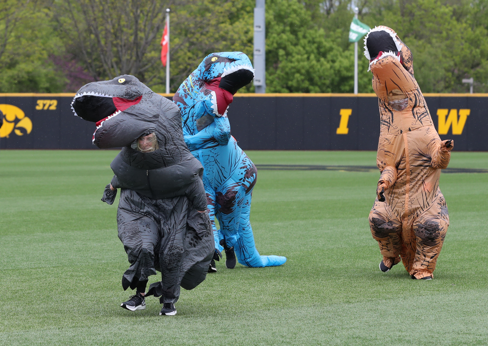 Rachel Heller, Susie Lund, and Emily run the dinosaur race during the Iowa Hawkeyes game against Michigan State Sunday, May 12, 2019 at Duane Banks Field. (Brian Ray/hawkeyesports.com)