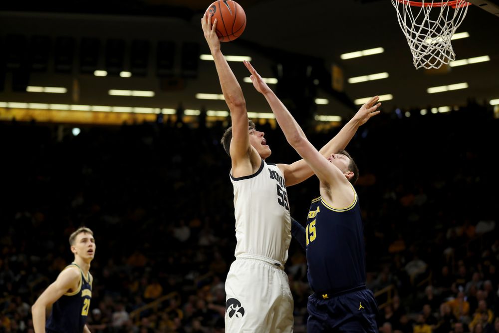Iowa Hawkeyes forward Luka Garza (55) puts up a shot against the Michigan Wolverines Friday, January 17, 2020 at Carver-Hawkeye Arena. (Brian Ray/hawkeyesports.com)