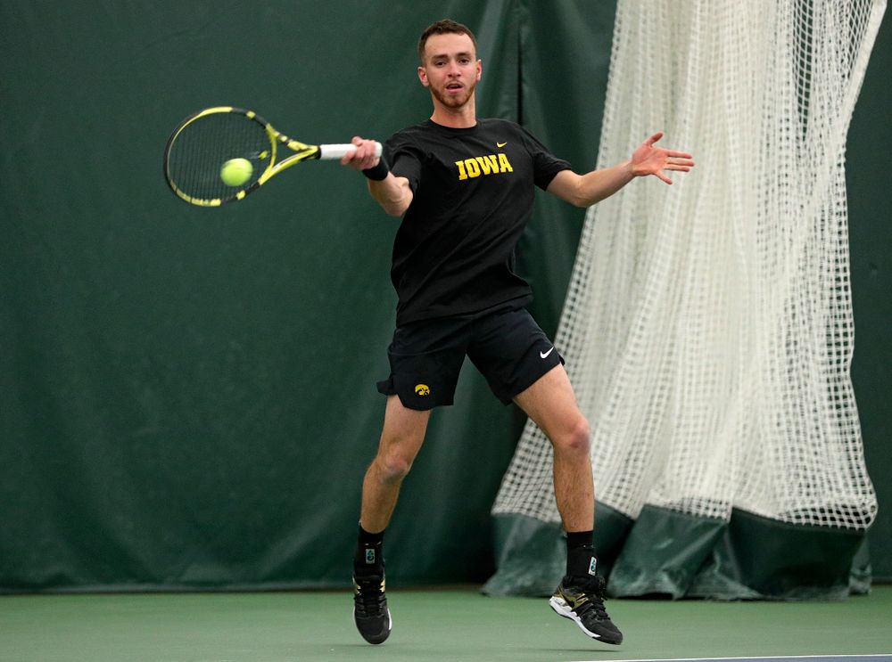 Iowa’s Kareem Allaf returns a shot during his singles match at the Hawkeye Tennis and Recreation Complex in Iowa City on Friday, March 6, 2020. (Stephen Mally/hawkeyesports.com)