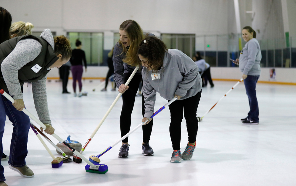 Members of the Iowa Softball team learn the sport of curling as part of a team building event Wednesday, January 10, 2018 at the Cedar Rapids Ice Arena. (Brian Ray/hawkeyesports.com)