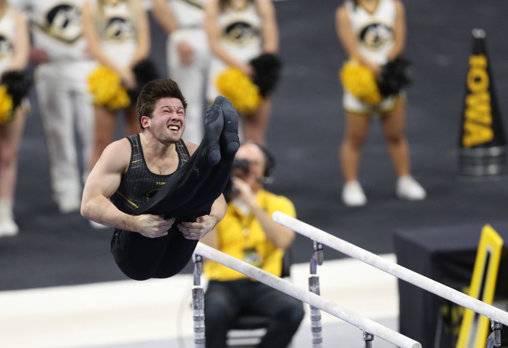 Iowa's Rogelio Vazquez competes on the parallel bars against Oklahoma Saturday, February 9, 2019 at Carver-Hawkeye Arena. (Brian Ray/hawkeyesports.com)