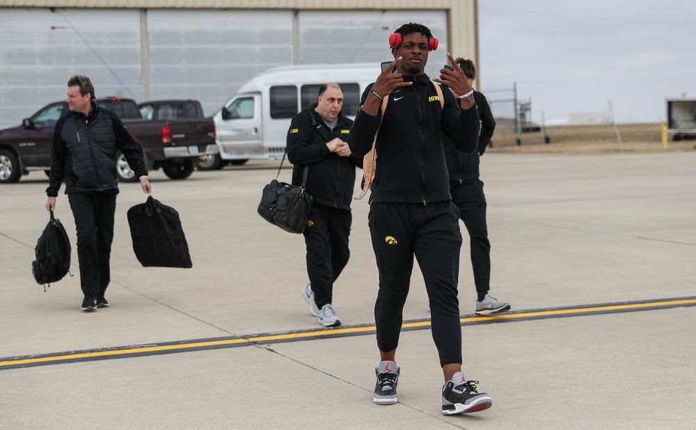 Iowa Hawkeyes forward Tyler Cook (25) boards a flight to Columbus for the first and second rounds of the 2019 NCAA Men's Basketball Tournament Wednesday, March 20, 2019 at the Eastern Iowa Airport. (Brian Ray/hawkeyesports.com)