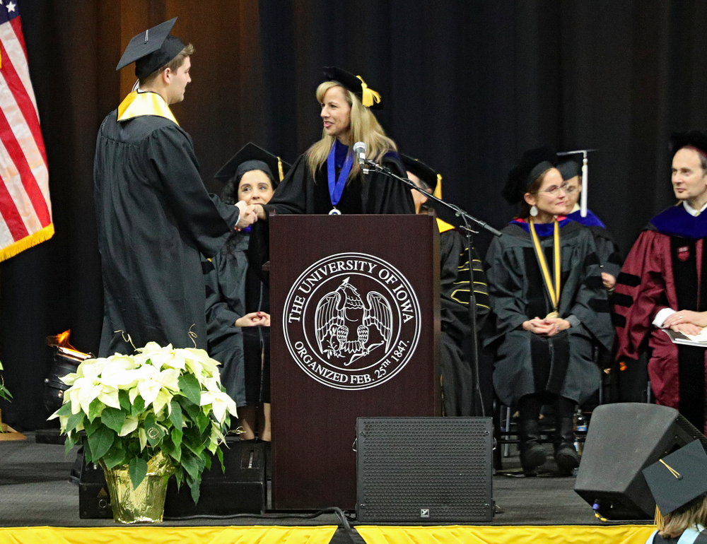 Iowa Spirit Squad’s Joseph Bartemes during the College of Liberal Arts and Sciences and University College Fall 2019 Commencement ceremony at Carver-Hawkeye Arena in Iowa City on Saturday, December 21, 2019. (Stephen Mally/hawkeyesports.com)