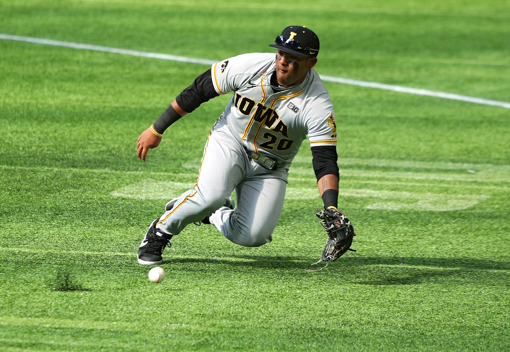 Iowa Hawkeyes infielder Izaya Fullard (20) fields a ground ball during the fourth inning of their CambriaCollegeClassic game at U.S. Bank Stadium in Minneapolis, Minn. on Friday, February 28, 2020. (Stephen Mally/hawkeyesports.com)