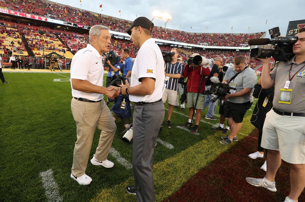 Iowa Hawkeyes head coach Kirk Ferentz talks with Iowa State Cyclones head coach Matt Campbell before their game Saturday, September 14, 2019 at Jack Trice Stadium in Ames, Iowa. (Brian Ray/hawkeyesports.com)