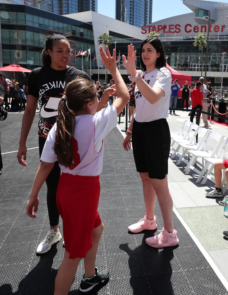 Iowa Hawkeyes forward Megan Gustafson (10) and UCONNÕs Napheesa Collier coach a team during a youth clinic and game Friday, April 12, 2019 in the XBOX Plaza at LA Live. (Brian Ray/hawkeyesports.com)
