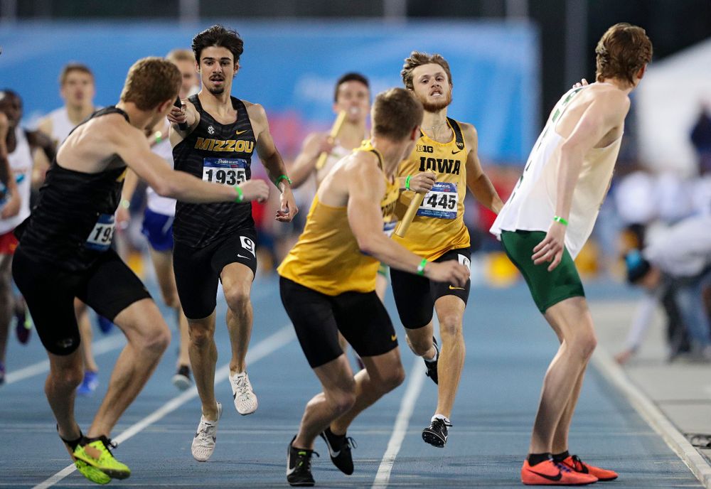 Iowa's Tysen VanDraska prepares to hand off the baton to Alec Still runs the men's 3200 meter relay event during the second day of the Drake Relays at Drake Stadium in Des Moines on Friday, Apr. 26, 2019. (Stephen Mally/hawkeyesports.com)