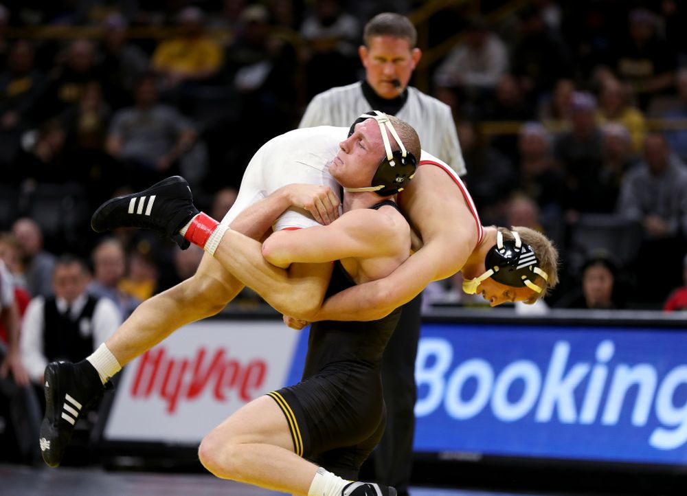 Iowa’s Kaleb Young wrestles Nebraska’s Peyton Rob at 157 pounds Saturday, January 18, 2020 at Carver-Hawkeye Arena. Young won the match 6-4. (Brian Ray/hawkeyesports.com)