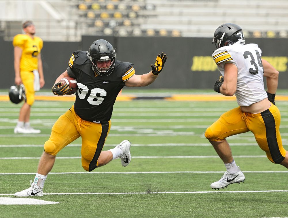 Iowa Hawkeyes fullback Brady Ross (36) tries to hold off linebacker Kristian Welch (34) during Fall Camp Practice No. 8 at Kids Day at Kinnick Stadium in Iowa City on Saturday, Aug 10, 2019. (Stephen Mally/hawkeyesports.com)