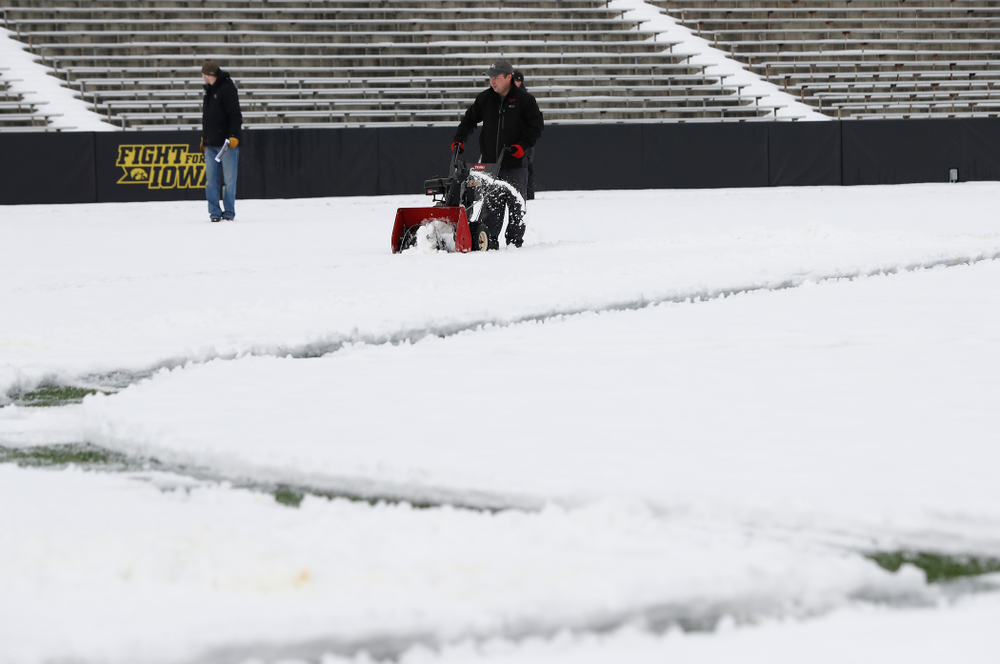 Members of the Iowa Athletics Turf Management staff create the #SnowWave for kids in the Stead Family Children's Hospital Thursday, February
