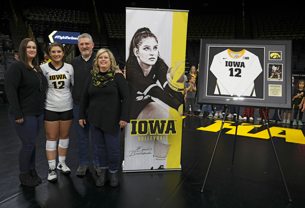Iowa’s Emily Bushman (12) is honored with her family on Senior Day before their match at Carver-Hawkeye Arena in Iowa City on Saturday, Nov 30, 2019. (Stephen Mally/hawkeyesports.com)