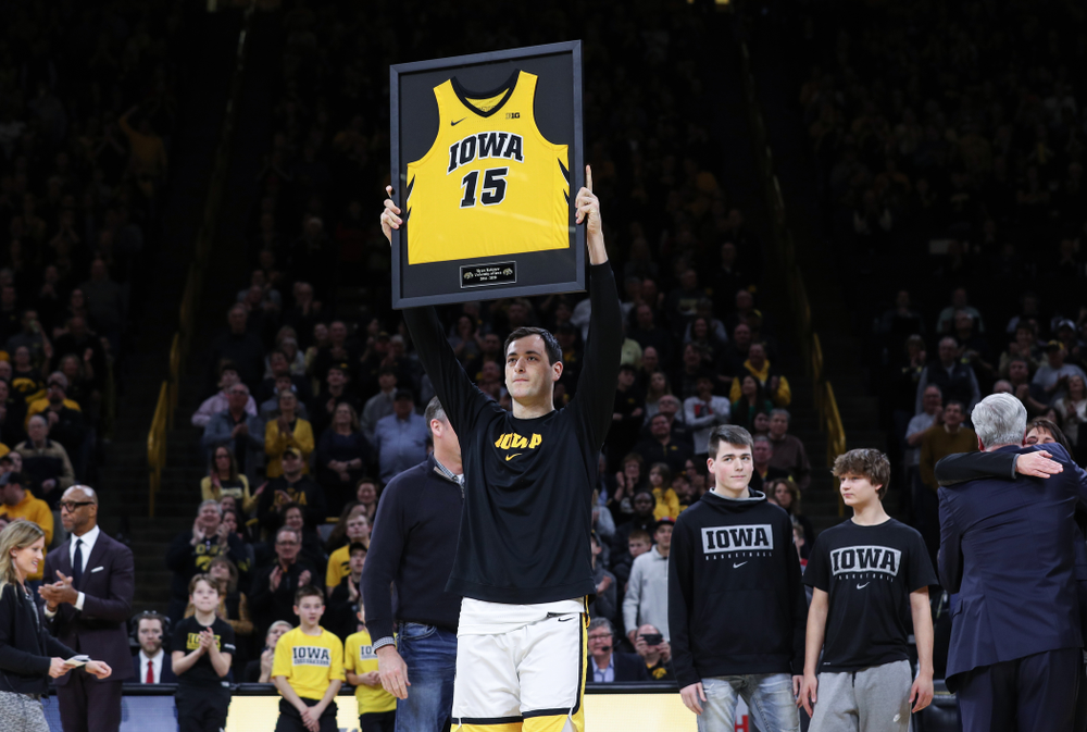 Iowa Hawkeyes forward Ryan Kriener (15) hold up his jersey during senior night activities before their game against the Purdue Boilermakers Tuesday, March 3, 2020 at Carver-Hawkeye Arena. (Brian Ray/hawkeyesports.com)