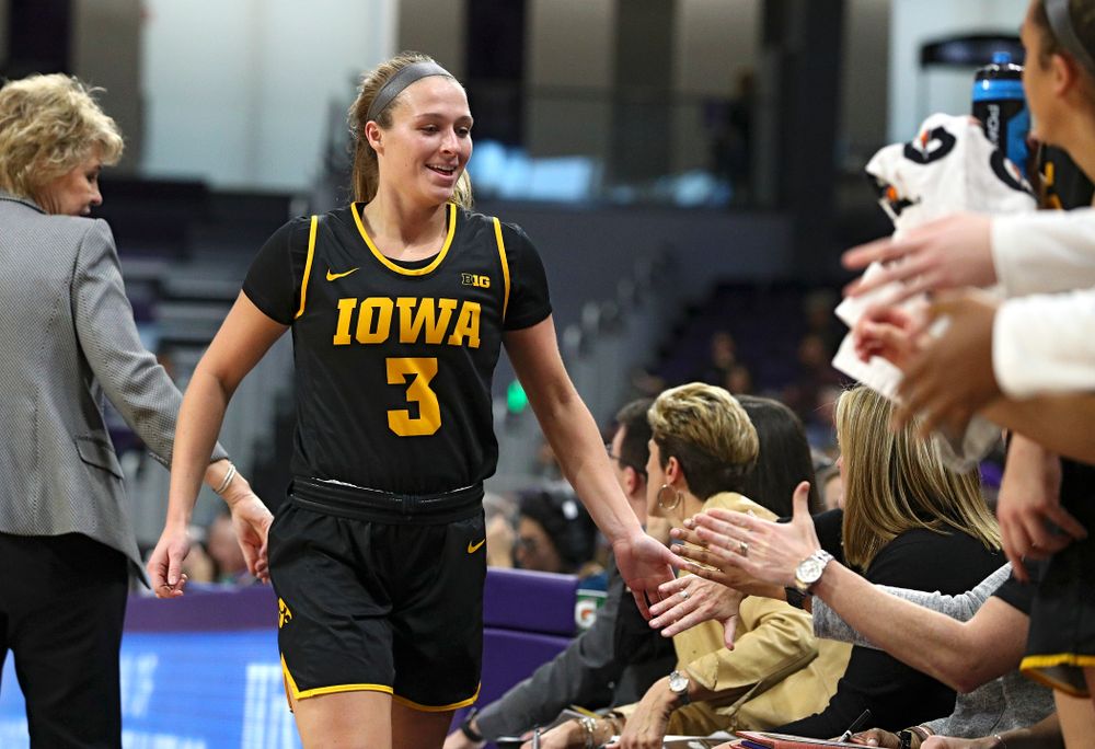 Iowa Hawkeyes guard Makenzie Meyer (3) smiles as she comes off the floor during the fourth quarter of their game at Welsh-Ryan Arena in Evanston, Ill. on Sunday, January 5, 2020. (Stephen Mally/hawkeyesports.com)