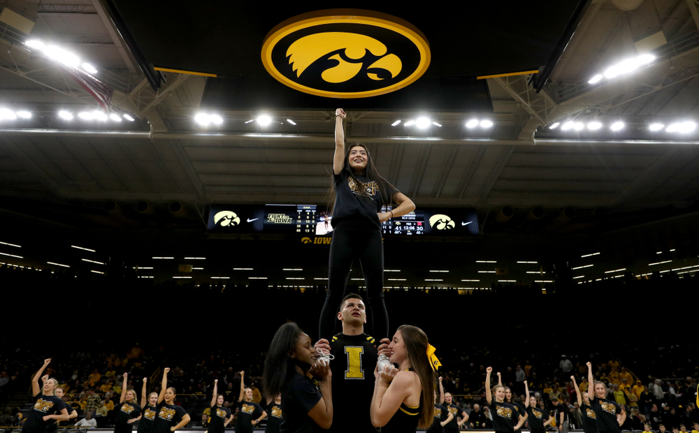 The Iowa Spirit Squad performs with participants in Spirit Squad Day at halftime of the Iowa Hawkeyes game against the Nebraska Cornhuskers Saturday, February 8, 2020 at Carver-Hawkeye Arena. (Brian Ray/hawkeyesports.com)