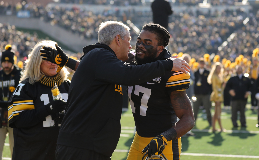 Iowa Hawkeyes defensive back Devonte Young (17) and Kirk and Mary Ferentz during Senior Day festivities before their game against the Illinois Fighting Illini Saturday, November 23, 2019 at Kinnick Stadium. (Brian Ray/hawkeyesports.com)