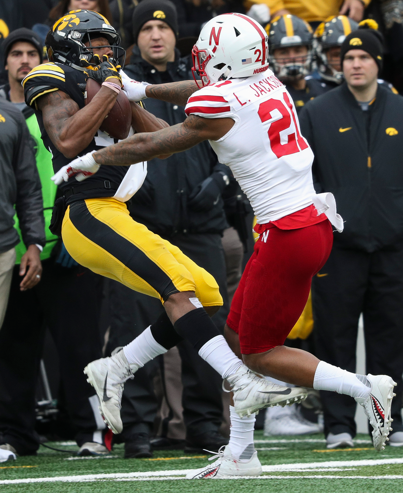 Iowa Hawkeyes wide receiver Brandon Smith (12) makes a first down reception during a game against Nebraska at Kinnick Stadium on November 23, 2018. (Tork Mason/hawkeyesports.com)