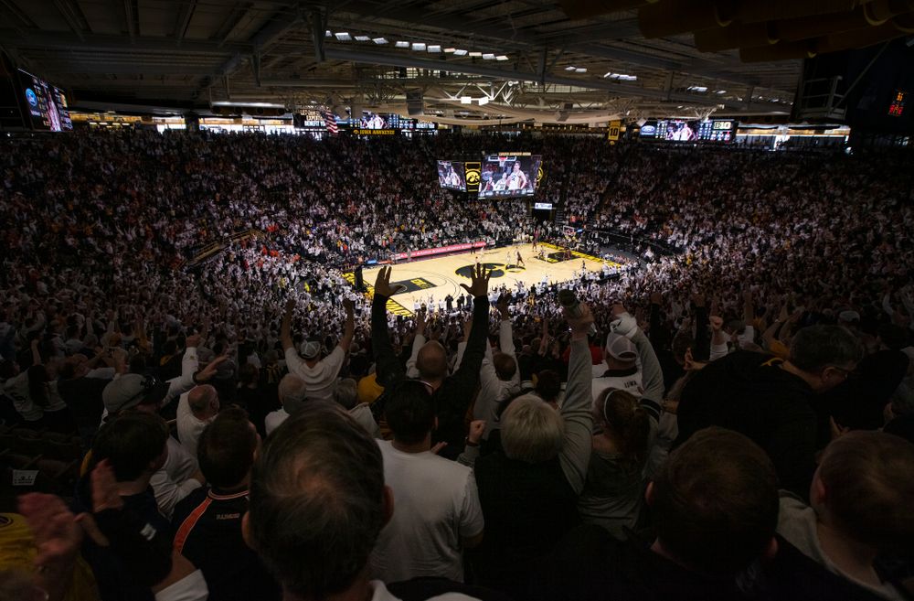 Fan celebrate a three point basket by forward Luka Garza (55) against the Illinois Fighting Illini Sunday, February 2, 2020 at Carver-Hawkeye Arena. (Brian Ray/hawkeyesports.com)