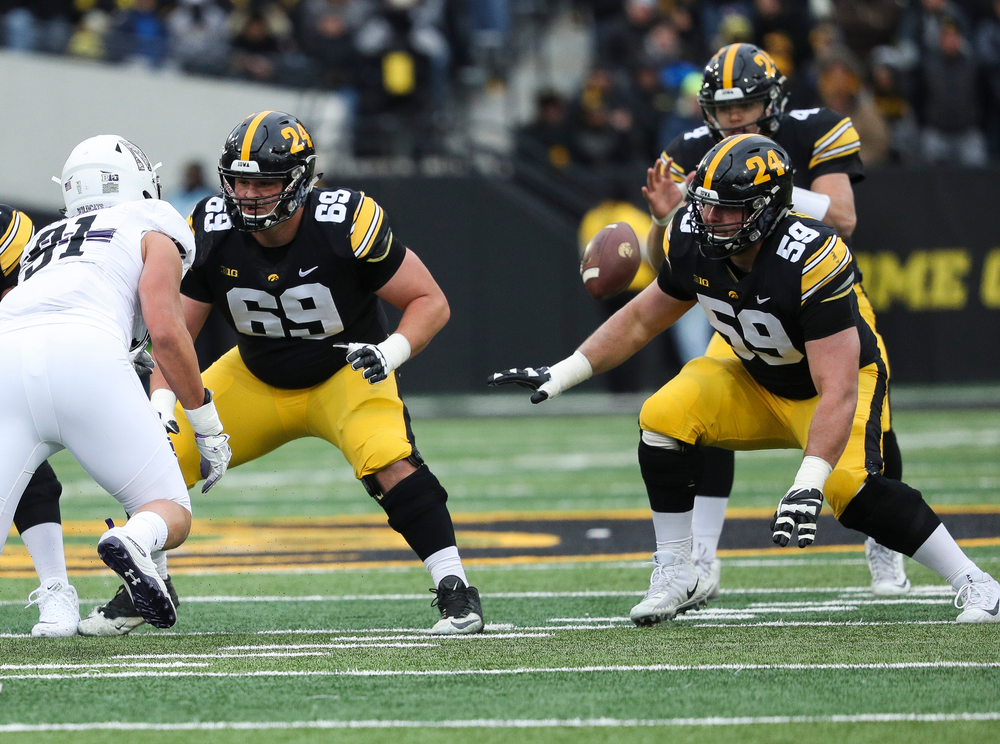 Iowa Hawkeyes offensive lineman Keegan Render (69) blocks during a game against Northwestern at Kinnick Stadium on November 10, 2018. (Tork Mason/hawkeyesports.com)