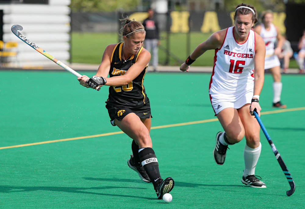 Iowa’s Sophie Sunderland (20) lines up a shot during the first quarter of their match at Grant Field in Iowa City on Friday, Oct 4, 2019. (Stephen Mally/hawkeyesports.com)