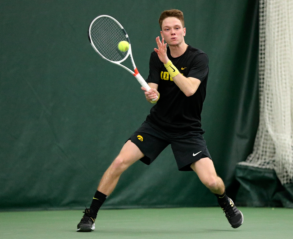 Iowa’s Jason Kerst returns a shot during his singles match at the Hawkeye Tennis and Recreation Complex in Iowa City on Friday, February 14, 2020. (Stephen Mally/hawkeyesports.com)