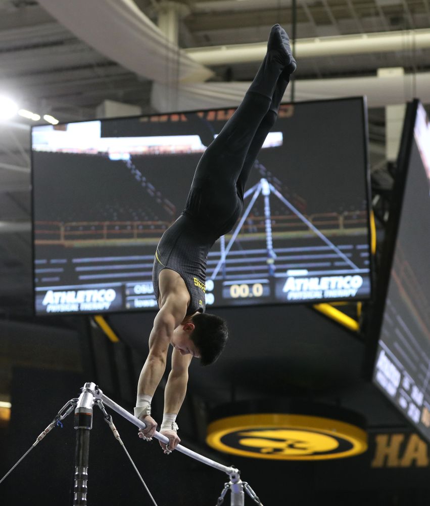 Iowa's Bennet Huang competes on the high bar against the Ohio State Buckeyes Saturday, March 16, 2019 at Carver-Hawkeye Arena. (Brian Ray/hawkeyesports.com)