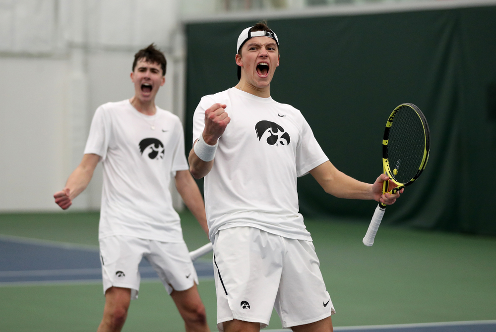 Iowa’s Joe Tyler and Matt Cleggle celebrating after winning a doubles match against Cornell Sunday, March 8, 2020 at the Hawkeye Tennis and Recreation Center. (Brian Ray/hawkeyesports.com)