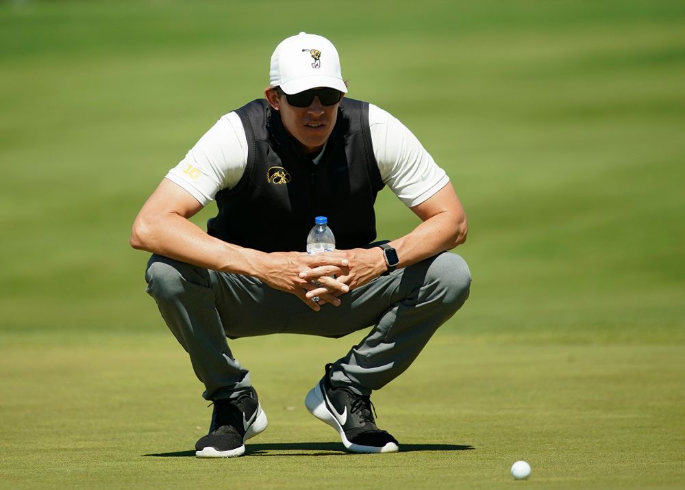 Iowa assistant coach Charlie Hoyle studies the green during the second round of the Hawkeye Invitational at Finkbine Golf Course in Iowa City on Saturday, Apr. 20, 2019. (Stephen Mally/hawkeyesports.com)