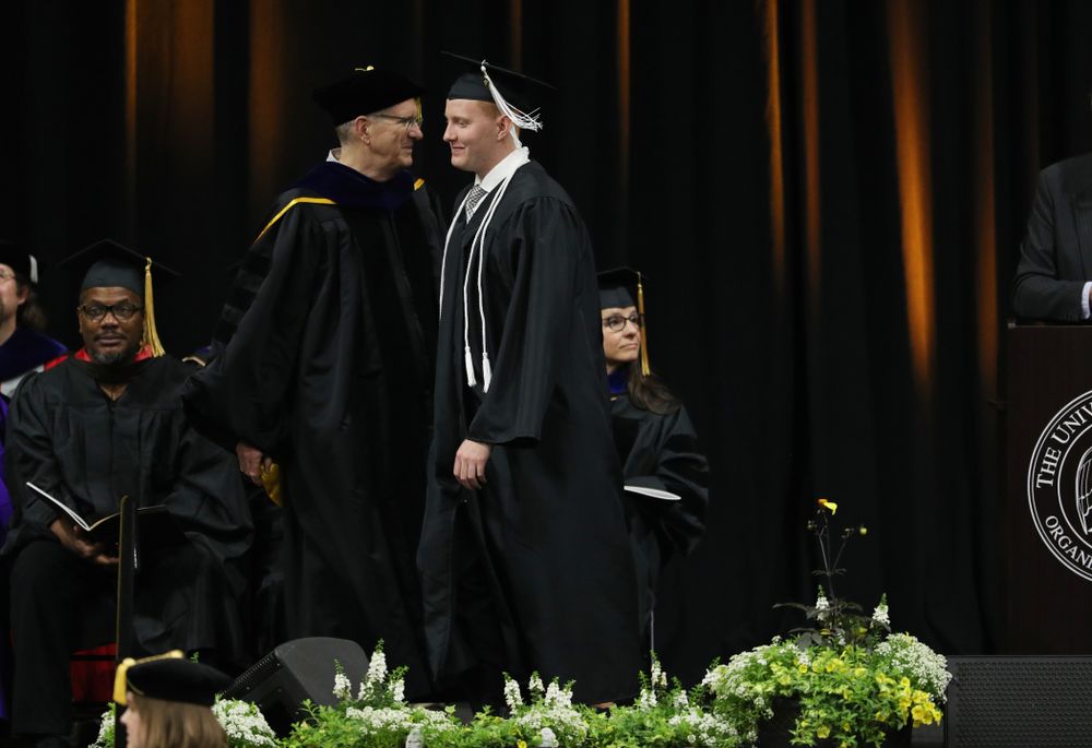 Iowa MenÕs Basketball Manager Trevor Smith during the College of Liberal Arts and Sciences spring commencement Saturday, May 11, 2019 at Carver-Hawkeye Arena. (Brian Ray/hawkeyesports.com)