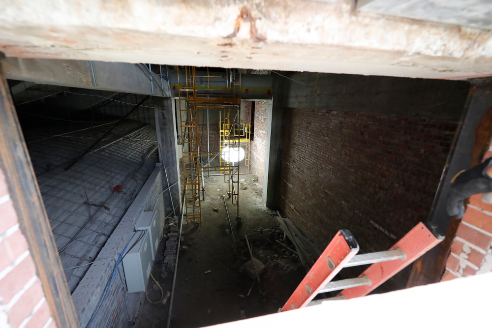 A new opening that connects the club level of the new north end zone to a service corridor, and storage area in the west stands under the press box Wednesday, June 6, 2018 at Kinnick Stadium. The corridor allows the club area to utilize the commercial kitchen in the press box. (Brian Ray/hawkeyesports.com)
