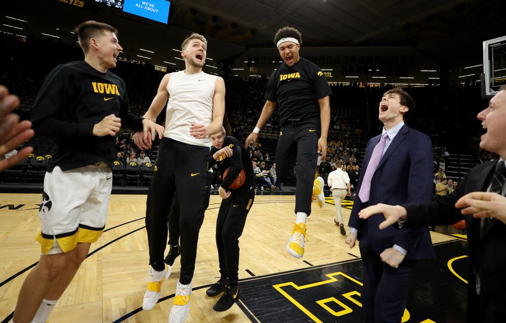 Iowa Hawkeyes guard Austin Ash (13), forward Riley Till (20), and forward Cordell Pemsl (35) against the Michigan Wolverines Friday, January 17, 2020 at Carver-Hawkeye Arena. (Brian Ray/hawkeyesports.com)
