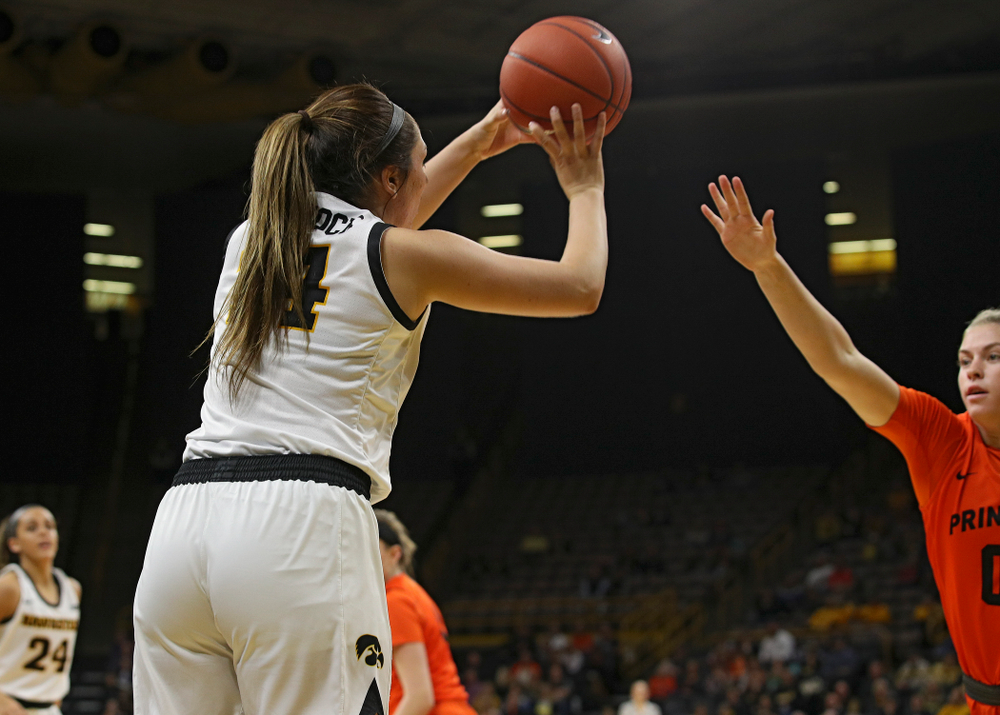 Iowa guard/forward McKenna Warnock (14) makes a 3-pointer during the third quarter of their overtime win against Princeton at Carver-Hawkeye Arena in Iowa City on Wednesday, Nov 20, 2019. (Stephen Mally/hawkeyesports.com)