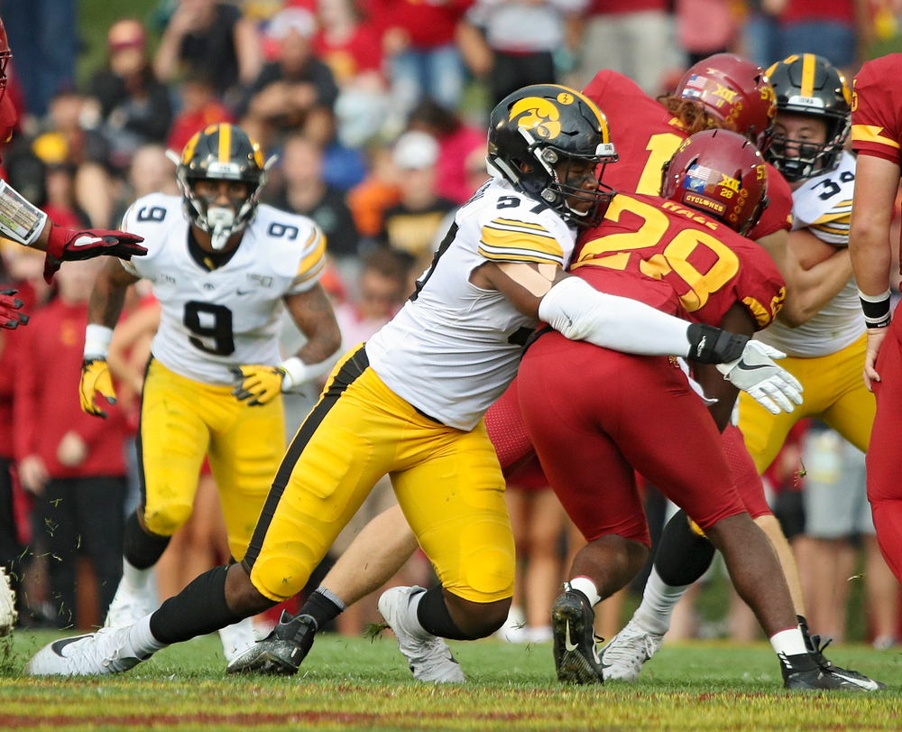 Iowa Hawkeyes defensive end Chauncey Golston (57) makes a tackle during the first quarter of their Iowa Corn Cy-Hawk Series game at Jack Trice Stadium in Ames on Saturday, Sep 14, 2019. (Stephen Mally/hawkeyesports.com)