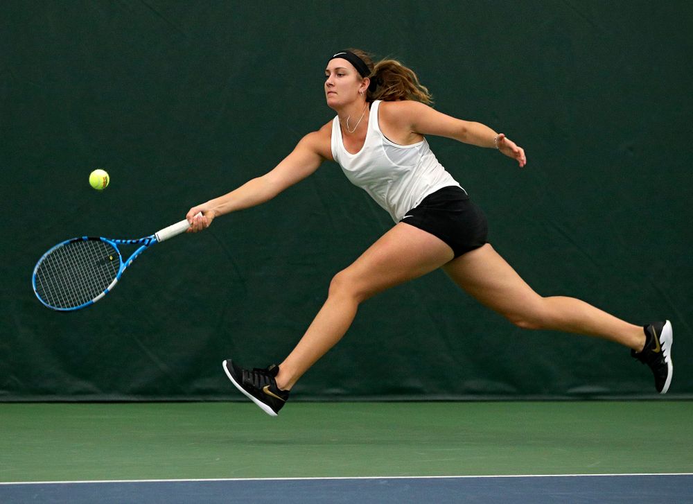 Iowa’s Ashleigh Jacobs returns a shot during her doubles match at the Hawkeye Tennis and Recreation Complex in Iowa City on Sunday, February 23, 2020. (Stephen Mally/hawkeyesports.com)