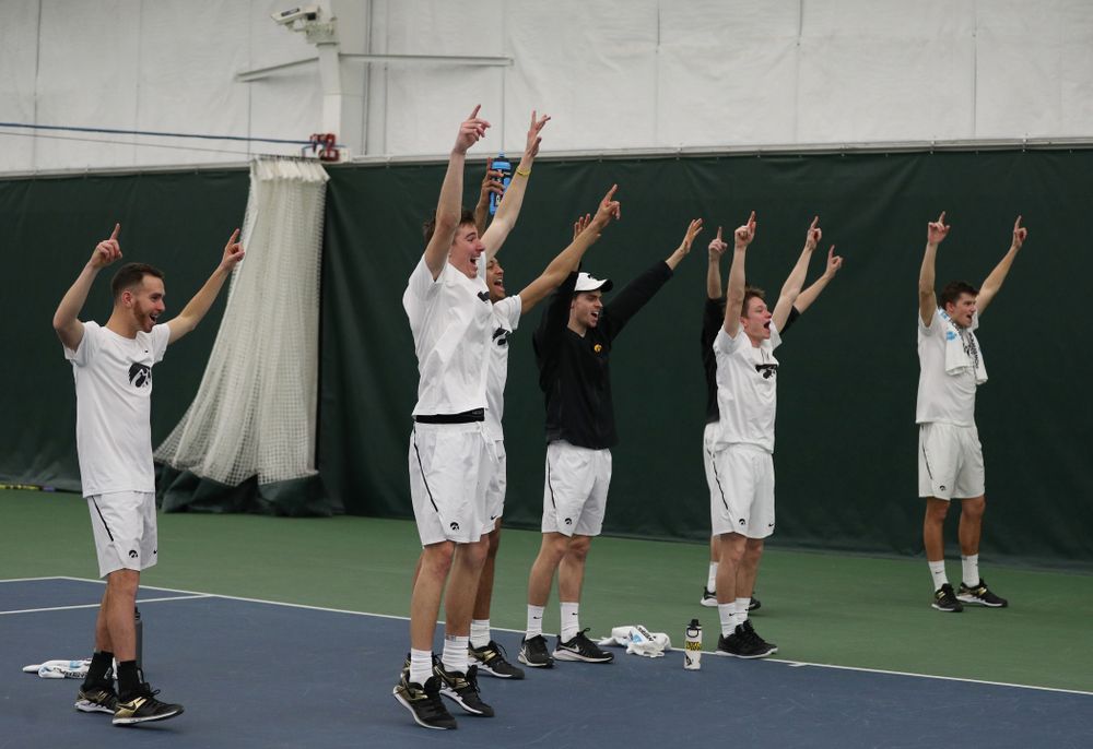 The Iowa Hawkeyes cheer on Will Davies against Cornell Sunday, March 8, 2020 at the Hawkeye Tennis and Recreation Center. (Brian Ray/hawkeyesports.com)