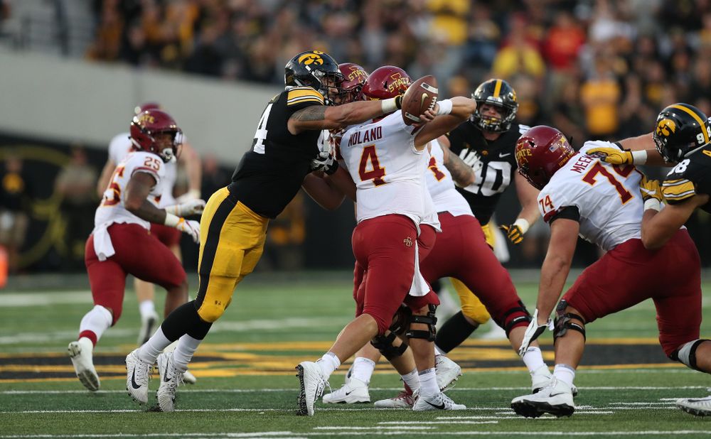 Iowa Hawkeyes defensive end A.J. Epenesa (94) strips the ball from Iowa State Cyclones quarterback Zeb Noland (4) Saturday, September 8, 2018 at Kinnick Stadium. (Max Allen/hawkeyesports.com)