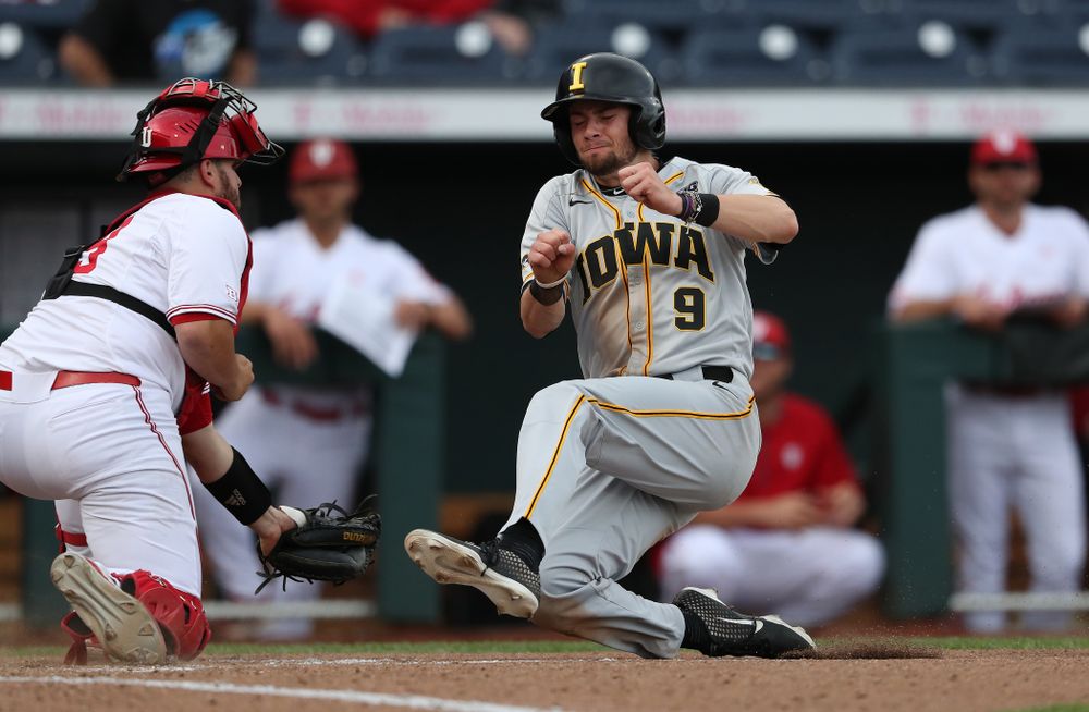 Iowa Hawkeyes outfielder Ben Norman (9) scores against the Indiana Hoosiers in the first round of the Big Ten Baseball Tournament Wednesday, May 22, 2019 at TD Ameritrade Park in Omaha, Neb. (Brian Ray/hawkeyesports.com)