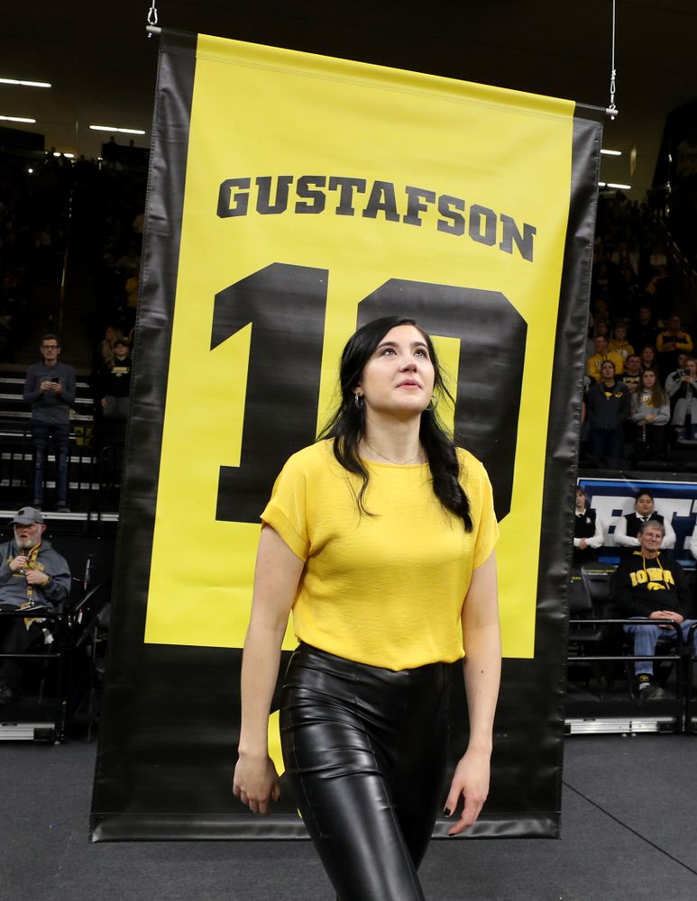 Megan Gustafson stands with her family as her number is raised into the rafters during a jersey retirement ceremony Sunday, January 26, 2020 at Carver-Hawkeye Arena. (Brian Ray/hawkeyesports.com)