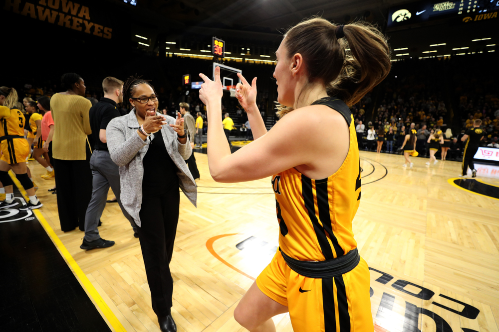 Iowa Hawkeyes forward Amanda Ollinger (43) and assistant coach Raina Harmon against the Minnesota Golden Gophers Thursday, February 27, 2020 at Carver-Hawkeye Arena. (Brian Ray/hawkeyesports.com)