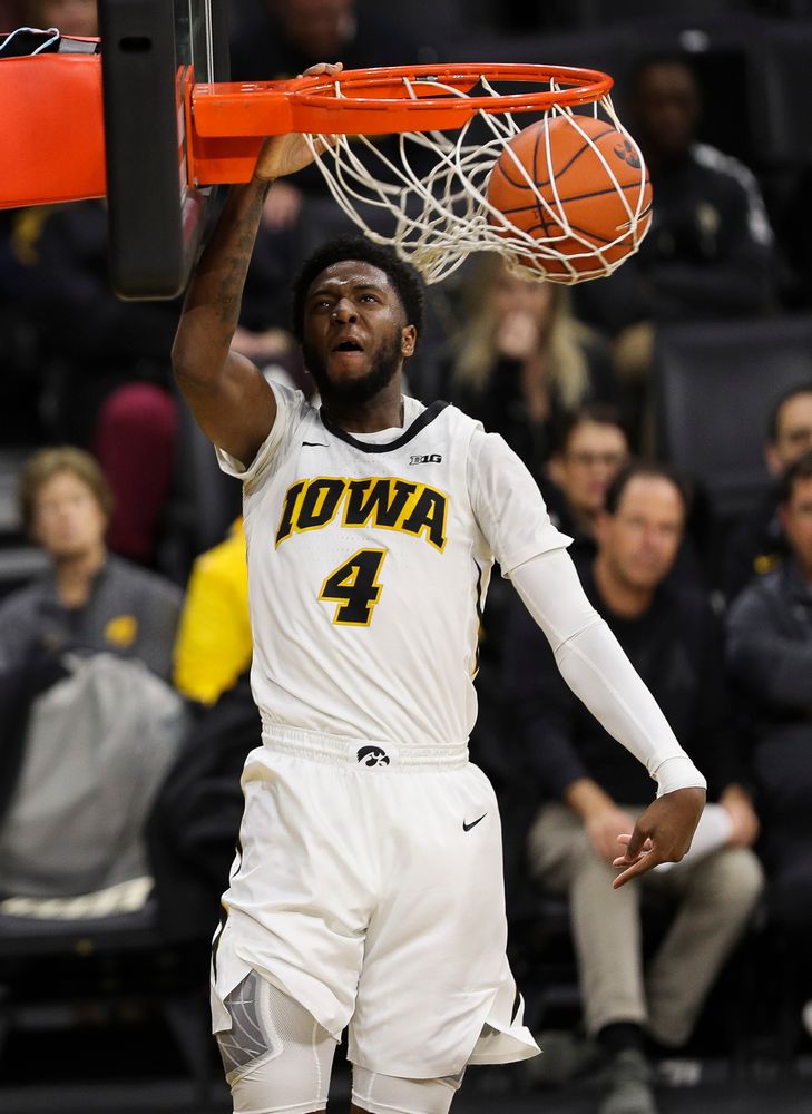 Iowa Hawkeyes guard Isaiah Moss (4) dunks the ball during a game against Guilford College at Carver-Hawkeye Arena on November 4, 2018. (Tork Mason/hawkeyesports.com)