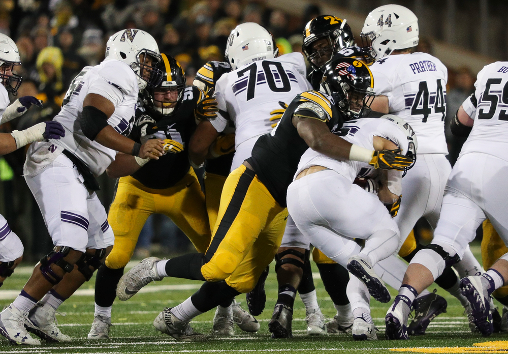 Iowa Hawkeyes defensive lineman Cedrick Lattimore (95) makes a tackle for loss during a game against Northwestern at Kinnick Stadium on November 10, 2018. (Tork Mason/hawkeyesports.com)