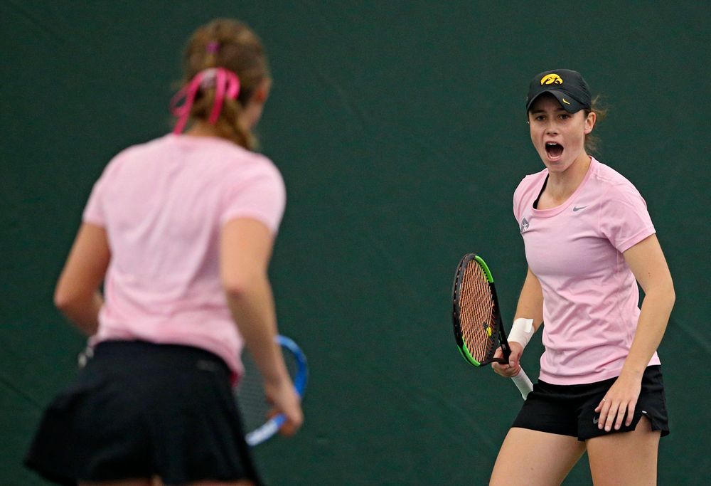 Iowa's Elise van Heuvelen Treadwell (right) and Ashleigh Jacobs celebrates a point during their doubles match against Purdue at the Hawkeye Tennis and Recreation Complex in Iowa City on Friday, Mar. 29, 2019. (Stephen Mally/hawkeyesports.com)