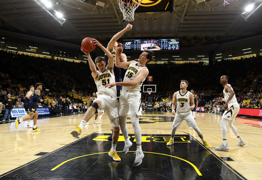 Iowa Hawkeyes forward Nicholas Baer (51) and forward Ryan Kriener (15) against the Michigan Wolverines Friday, February 1, 2019 at Carver-Hawkeye Arena. (Brian Ray/hawkeyesports.com)
