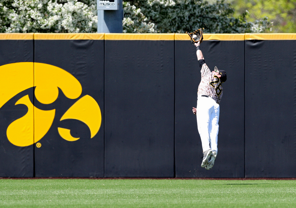Iowa Hawkeyes left fielder Chris Whelan (28) makes a diving catch for an out during the third inning of their game against UC Irvine at Duane Banks Field in Iowa City on Sunday, May. 5, 2019. (Stephen Mally/hawkeyesports.com)
