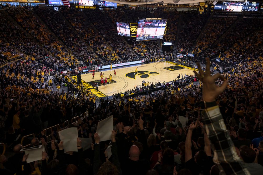 Fans of the Iowa Hawkeyes celebrate a three point basket against the Nebraska Cornhuskers Saturday, February 8, 2020 at Carver-Hawkeye Arena. (Brian Ray/hawkeyesports.com)