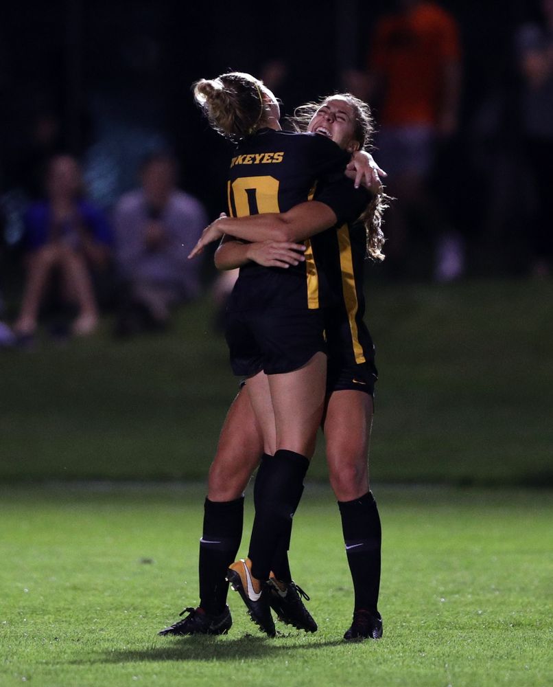 Iowa Hawkeyes midfielder/defender Natalie Winters (10) hugs forward Kaleigh Haus (4) after scoring during a 2-1 victory over the Iowa State Cyclones Thursday, August 29, 2019 in the Iowa Corn Cy-Hawk series at the Iowa Soccer Complex. (Brian Ray/hawkeyesports.com)