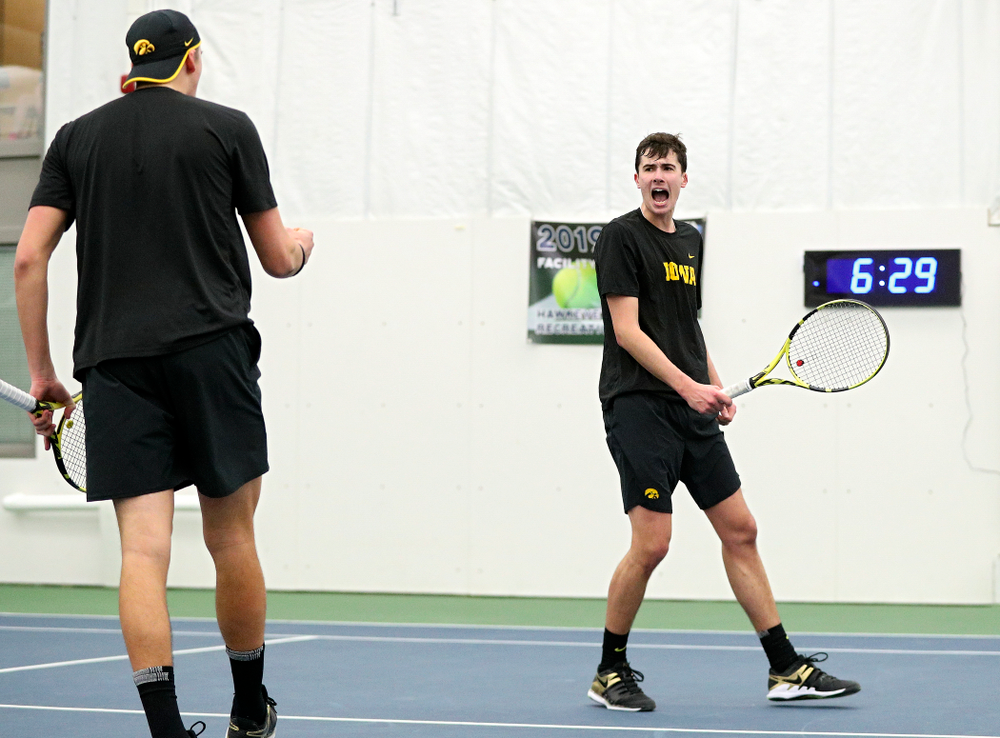 Iowa’s Joe Tyler (from left) and Matt Clegg celebrate a point during their doubles match at the Hawkeye Tennis and Recreation Complex in Iowa City on Friday, February 14, 2020. (Stephen Mally/hawkeyesports.com)