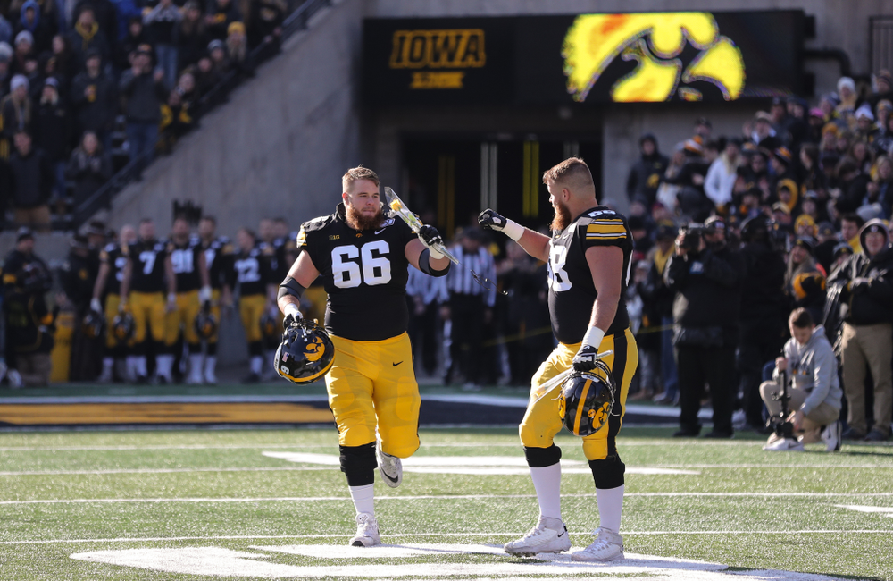 Iowa Hawkeyes offensive lineman Landan Paulsen (68) and offensive lineman Levi Paulsen (66) during Senior Day festivities before their game against the Illinois Fighting Illini Saturday, November 23, 2019 at Kinnick Stadium. (Brian Ray/hawkeyesports.com)