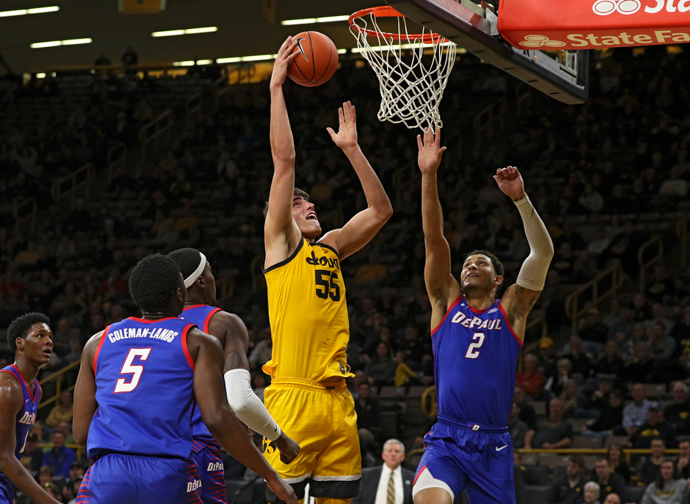Iowa Hawkeyes center Luka Garza (55) scores a basket during the second half of their game at Carver-Hawkeye Arena in Iowa City on Monday, Nov 11, 2019. (Stephen Mally/hawkeyesports.com)
